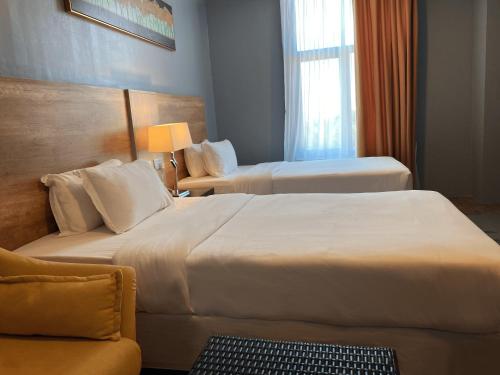 Letto o letti in una camera di The Lanes Hotel