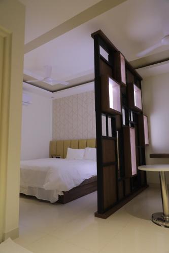 Una cama o camas en una habitación de Nandha Grande