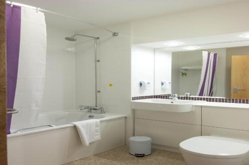 a bathroom with a toilet, sink, and shower at Premier Inn London Gatwick Airport - A23 Airport Way in Horley