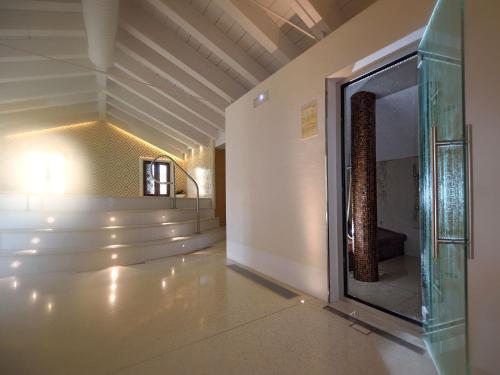 a hallway with a glass window in a building at Hotel Ai Reali - Small Luxury Hotels of the World in Venice