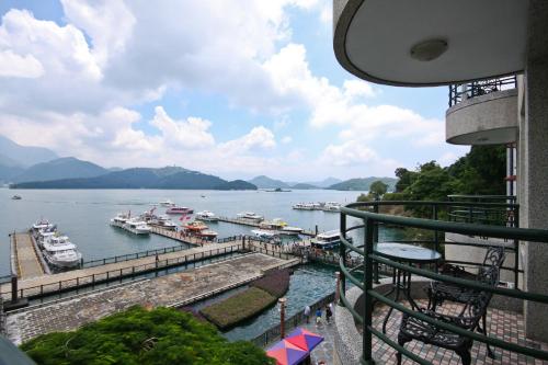 a view of a marina with boats in the water at Shui Sha Lian Hotel - Harbor Resort in Yuchi