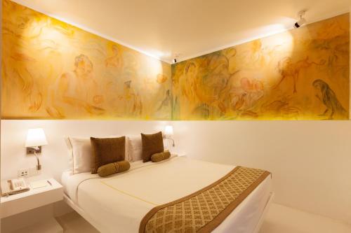 Ένα ή περισσότερα κρεβάτια σε δωμάτιο στο Le Sutra Hotel, Khar, Mumbai