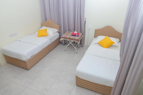 Ein Bett oder Betten in einem Zimmer der Unterkunft Nima guest house