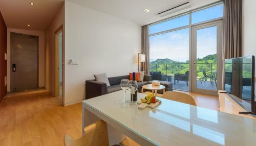 a kitchen and living room with a large window at Bayclub in Namhae