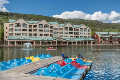 a resort with a bunch of inflatables on the water at Lakeshore by Summit County Mountain Retreats in Keystone