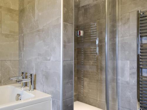 a bathroom with a shower and a sink at Apple Tree Cottage in Bassenthwaite