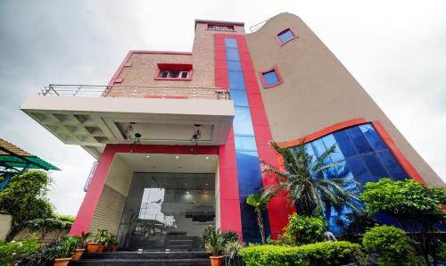 a building with a staircase in front of it at Treebo Trend MP Inn in Raipur