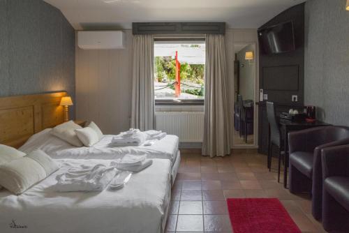 Postel nebo postele na pokoji v ubytování Tropical Hotel