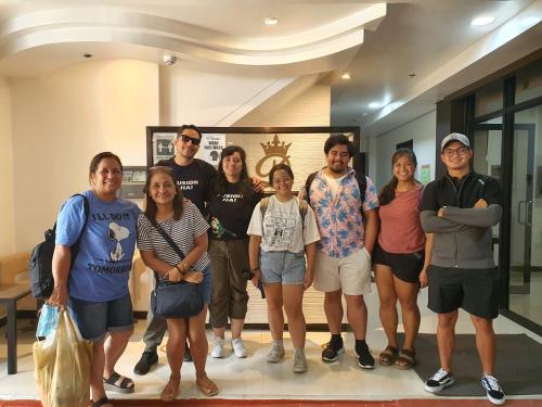 a group of people posing for a picture in a building at Dianna’s Inn in Coron