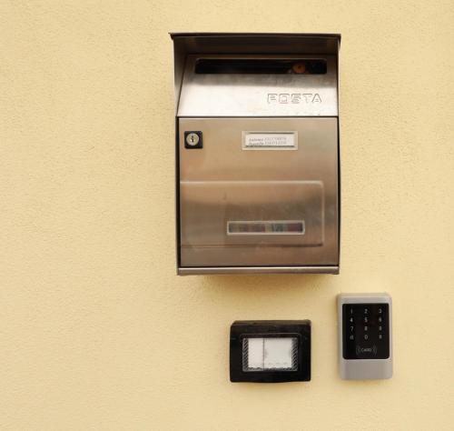 a fax machine is attached to a wall at Vient' e mar suite in Castellammare di Stabia