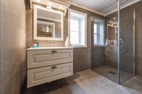 a bathroom with a sink and a shower at Cabin with sauna in Trysil in Trysil