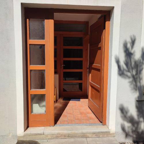 an open door of a building with a door at Large house with parking, 30 min to Prague center in Úvaly