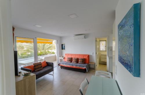 Posezení v ubytování Holiday apartment with direct sea promenade access
