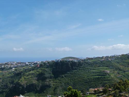 a view of a mountain with a town on it at Holiday Home El Brezal in El Palmital