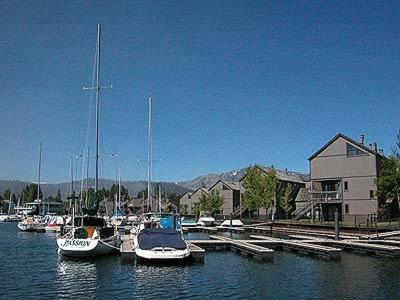 a group of boats docked in a marina on the water at Ala WaiApartment in South Lake Tahoe