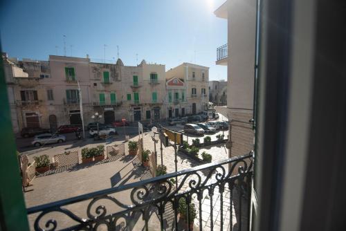 a view of a city street from a balcony at VICOLO MURO in Molfetta