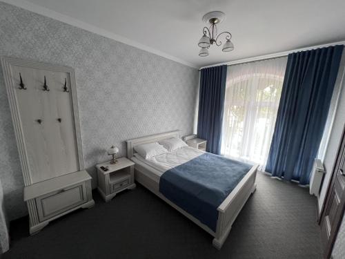 Ένα ή περισσότερα κρεβάτια σε δωμάτιο στο Zolotoy Fazan