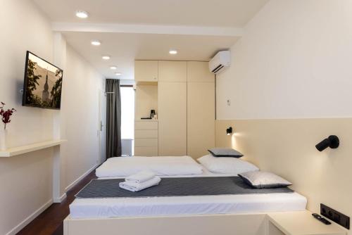 a bedroom with a bed with two pillows on it at Pension Chmelnice in Napajedla