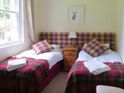 Кровать или кровати в номере Cloud Cottage