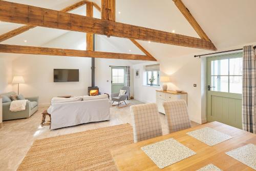 a living room with a couch and a table at The Irishman's Cottage in Yedingham