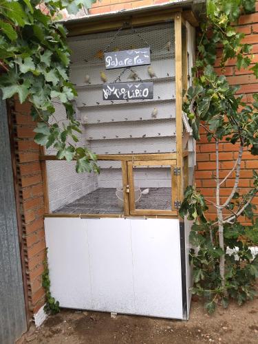 a door in a building with a sign on it at Miradoralaribera Chalet rural in Alcoba de la Ribera