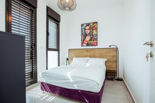 Katil atau katil-katil dalam bilik di הרצל בוטיק מבית דומוס - Herzl Boutique Apartments by Domus