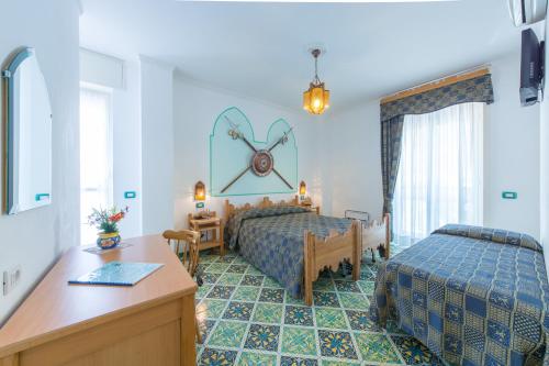 Posteľ alebo postele v izbe v ubytovaní Riviera B&B Rooms