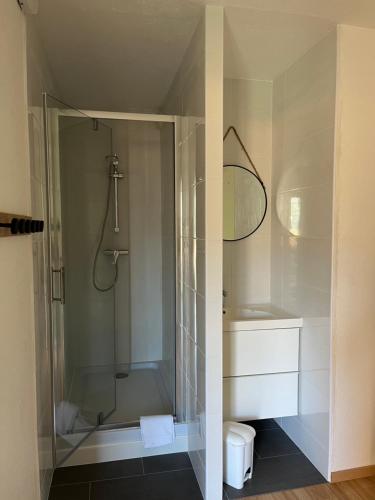 a bathroom with a shower and a sink and a toilet at Village Vacances Lou Castelet in Théoule-sur-Mer