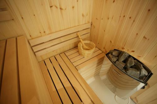 an inside view of a sauna with a tub at Vila Oaza mira Draganići in Raška