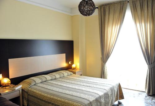 A bed or beds in a room at Hotel Gabbiano