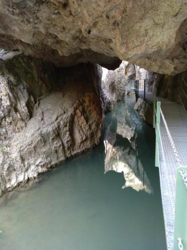 a cave with water and a bridge in it at Casa Rural La Torreta en El Rincón de Ademuz in Castielfabib