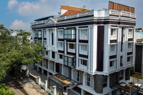 an overhead view of a white building at RATHNA RESIDENCY - Near US CONSULATE in Chennai