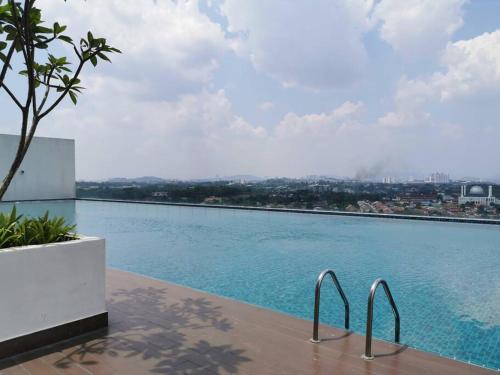 a view of a swimming pool from a building at Eko Studio@EVO SOHO BANGI with NETFLIX & WIFI in Kampong Sungai Ramal Dalam