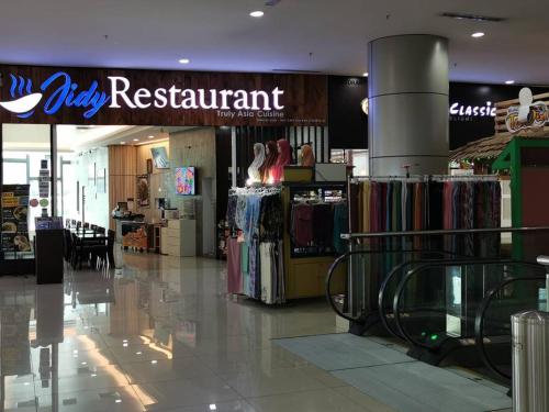 a clothing store with a sign that reads dirty restaurant at Eko Studio@EVO SOHO BANGI with NETFLIX & WIFI in Kampong Sungai Ramal Dalam