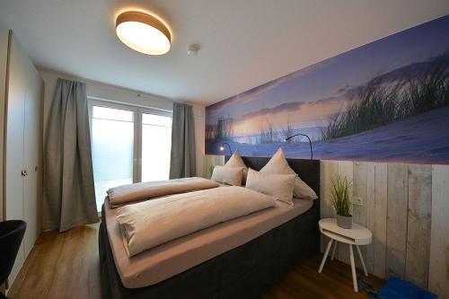 Postel nebo postele na pokoji v ubytování Ferienwohnung STRAND PIET
