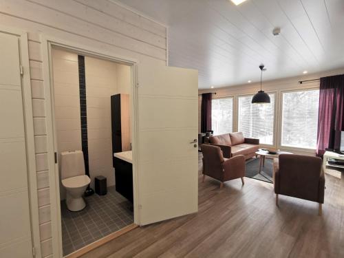 an open door to a room with a living room at Metsän Ukko in Syöte