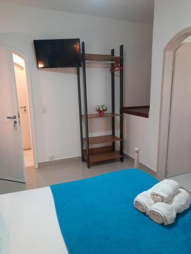 Ein Bett oder Betten in einem Zimmer der Unterkunft La Maison Brasiliana B&B