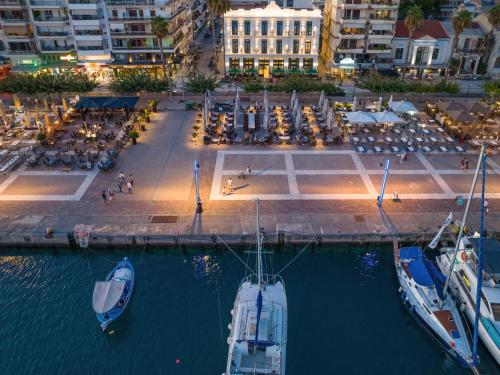 an aerial view of boats in a marina at night at Grand Hotel Kalamata in Kalamata