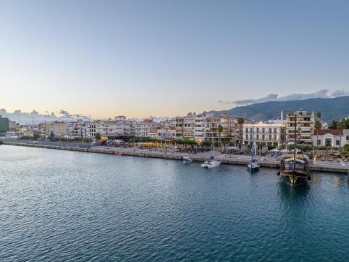 a large body of water with boats in a city at Grand Hotel Kalamata in Kalamata