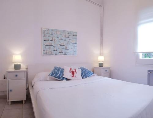 A bed or beds in a room at Enjoy your holidays 300m to the Mediterranean sea at Villa DIVALI