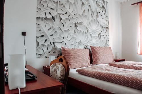 Ένα ή περισσότερα κρεβάτια σε δωμάτιο στο Hotel Alf