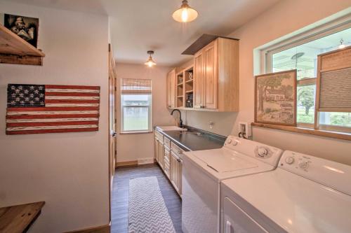 a kitchen with an american flag on the wall at Bright Shawano Lake Oasis - Walk to Boat Launch! in Shawano