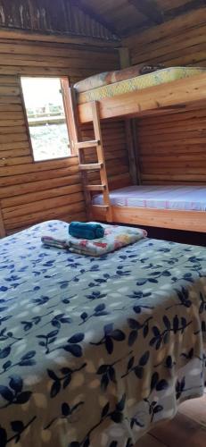 Katil atau katil-katil dalam bilik di Cabanas Pousada Esmeraldas