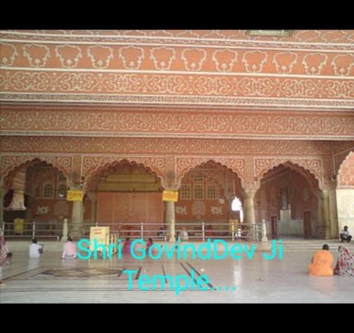 a group of people sitting in a large building at Sukh Sagar Hotel in Jaipur