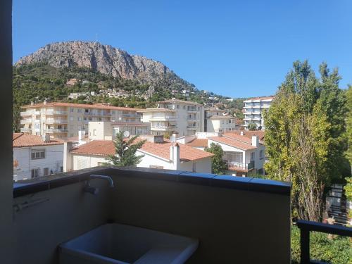 a view of a city with a mountain in the background at Payet Apartments in L'Estartit