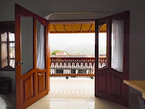 an open door with a view of a balcony at Apartamentos Primavera in Jardin