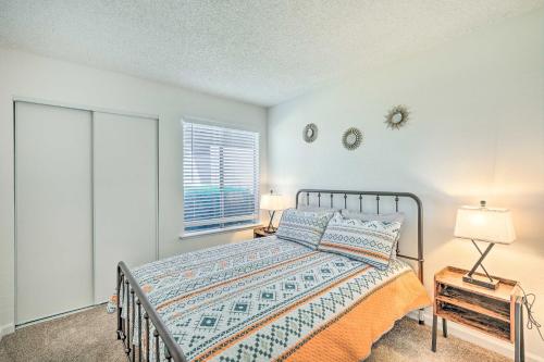 a bedroom with a bed with two lamps and a window at Modern Sacramento Home with Yard 12 Mi to Dtwn in Rancho Cordova