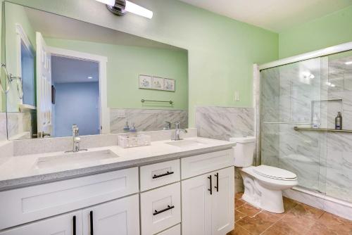 a bathroom with a sink and a toilet and a shower at Sarasota Home with Screened Porch, Walk To Zoo! in Sarasota