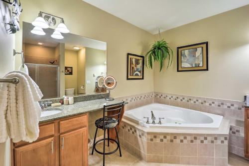a bathroom with a tub and a large mirror at Scenic Views! Ski-In/Ski-Out Condo in Beech Mtn in Beech Mountain