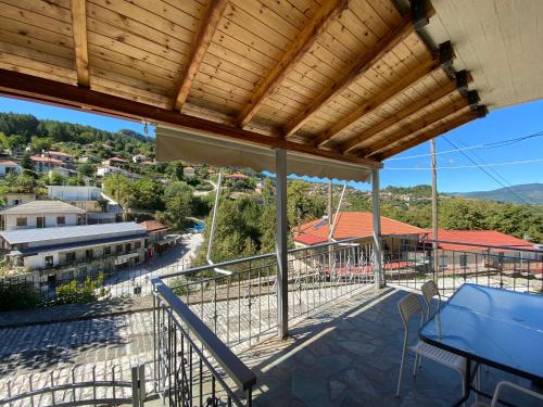 a balcony with a view of a town at Sofia’s House in Pramanta